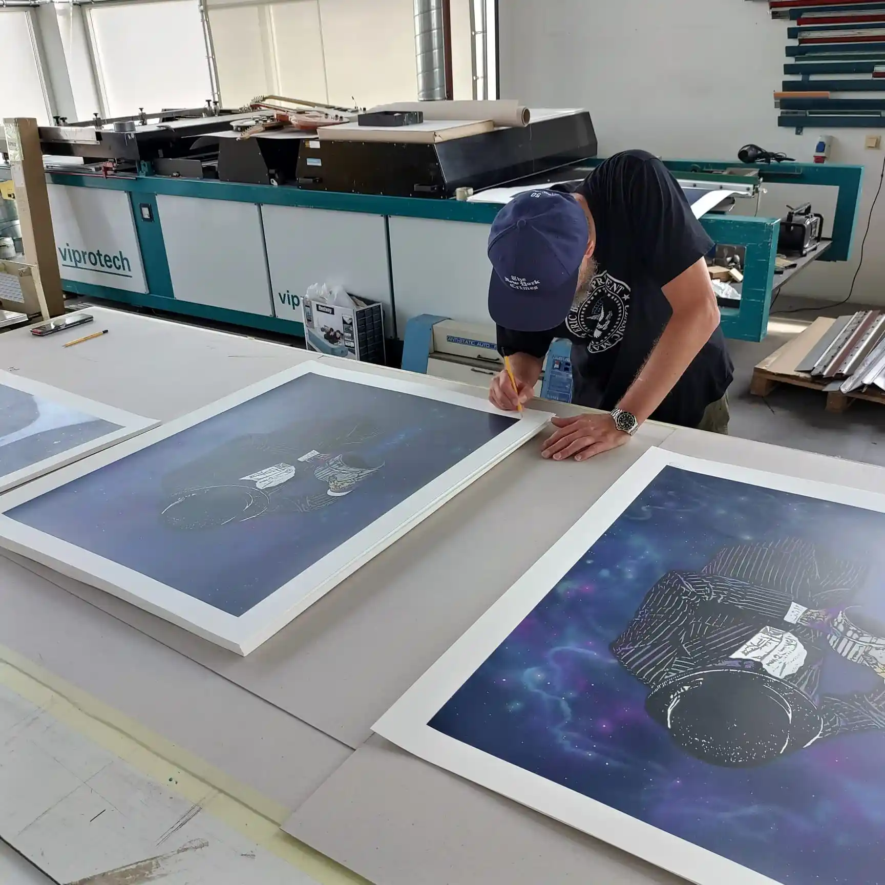 Nick Walker signs his new limited edition print Time and Space