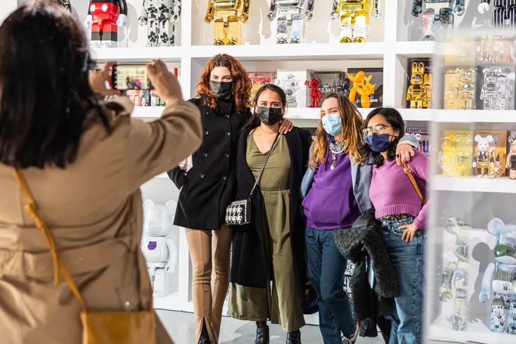 Visitors taking pictures in front of art toys and Bearbrick figures at 2B Art Gallery