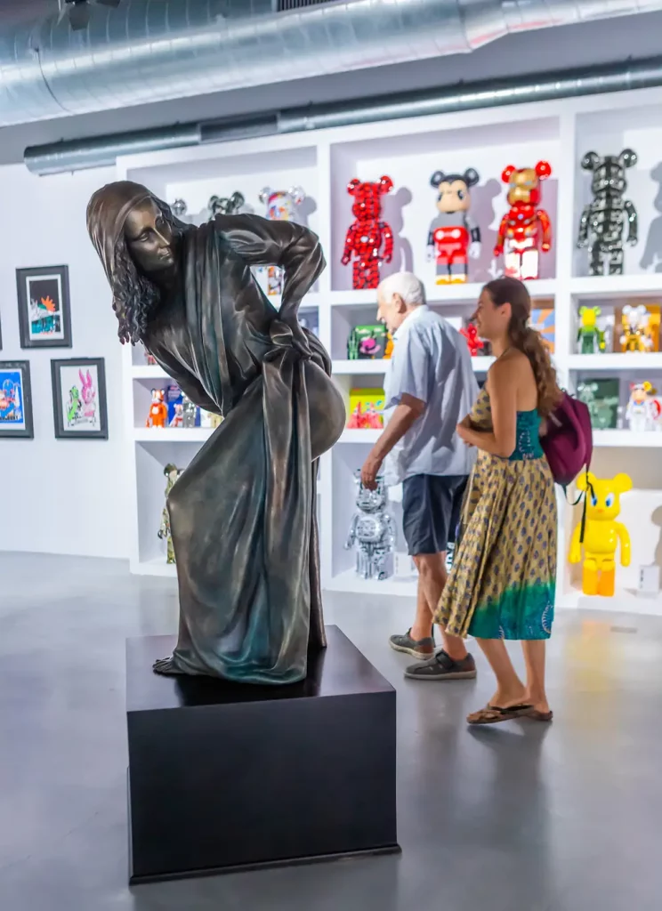 Nick Walker's art statue Moona Lisa and Bearbrick figures at 2B Art Gallery