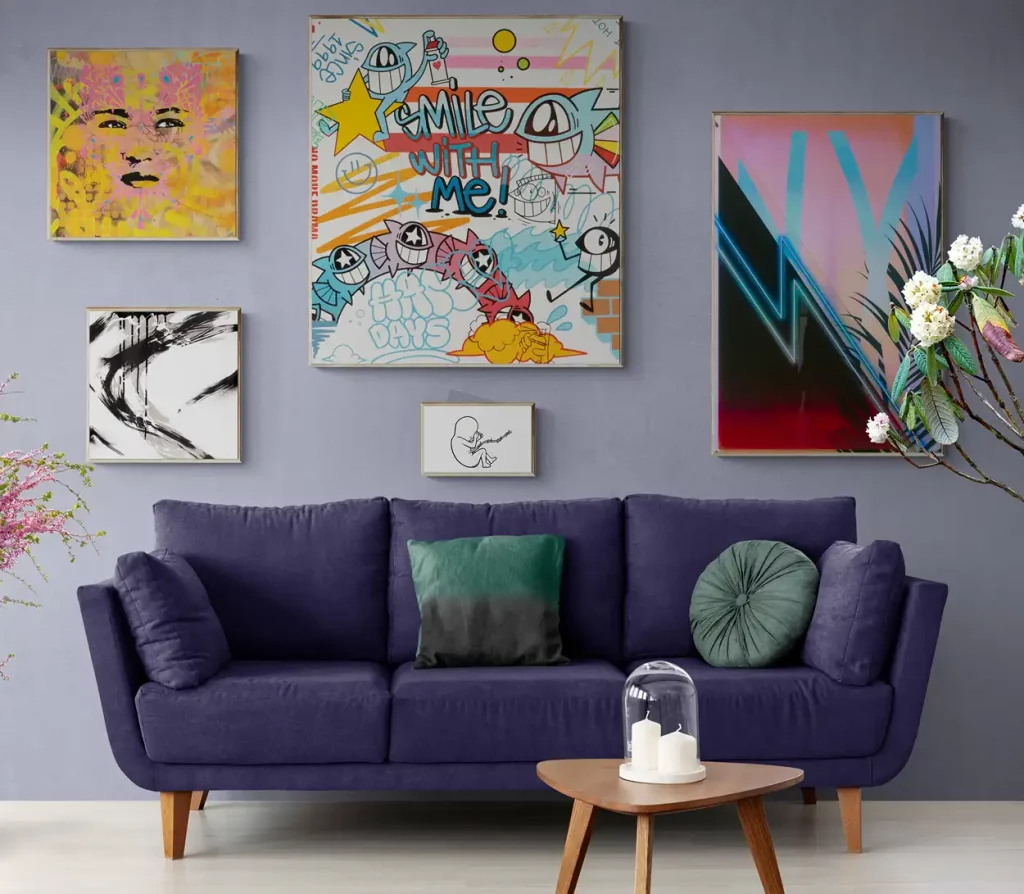 A gallery wall of urban art in a living room