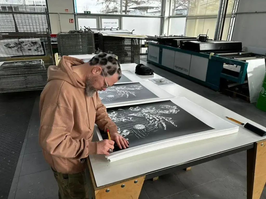 Nick Walker signs his limited edition print "Half the Time"
