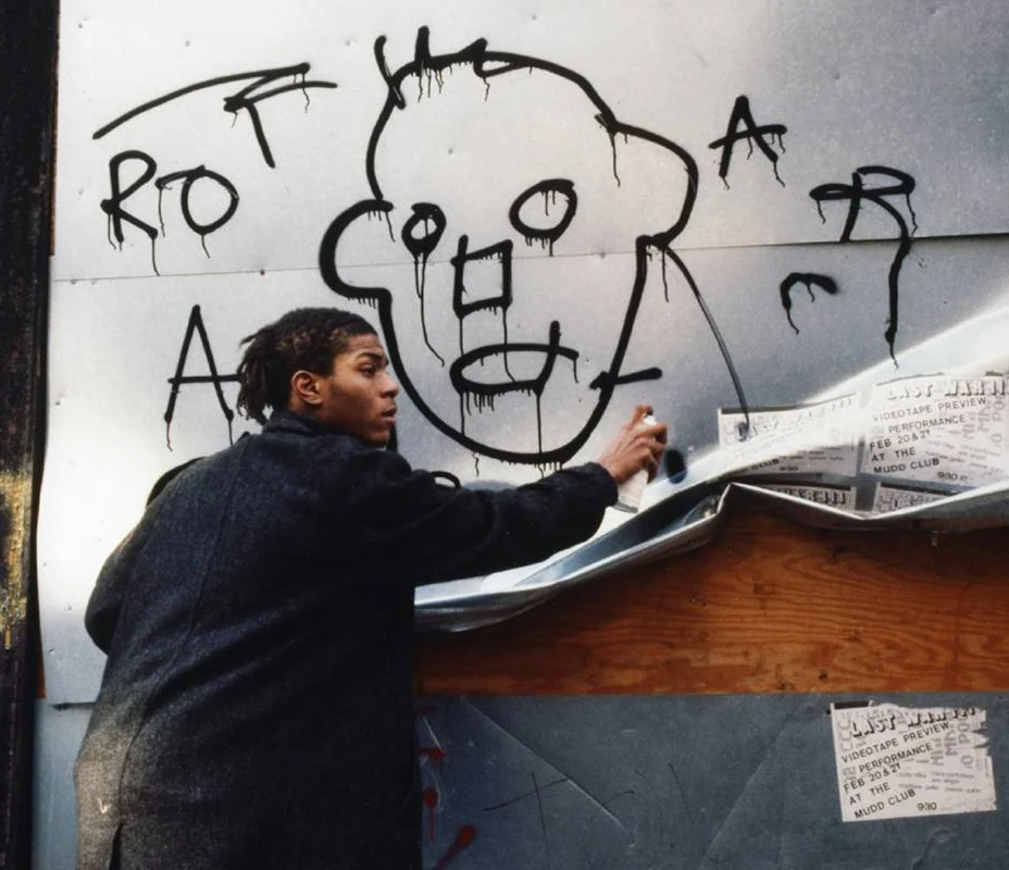 Jean-Michel Basquiat paints a graffiti in NYC