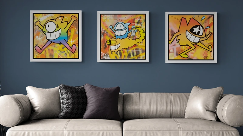 El Pez paintings hanged and framed in a living room